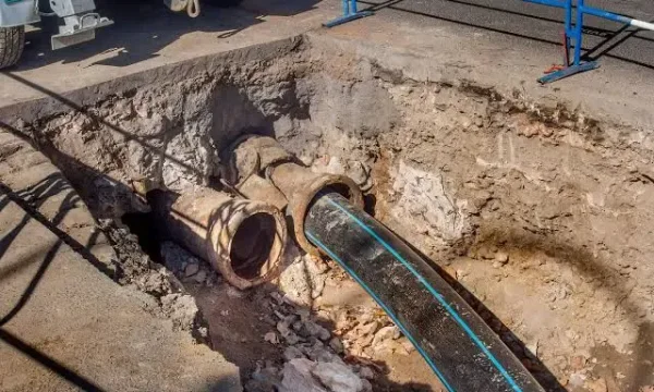 Sewer Line Excavation and Repair accessing underground pipe and restoring property